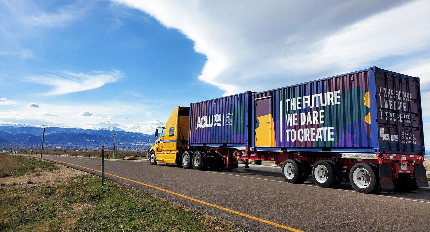 ACLU 50 State Blueprint on tour showing a truck with message printed on