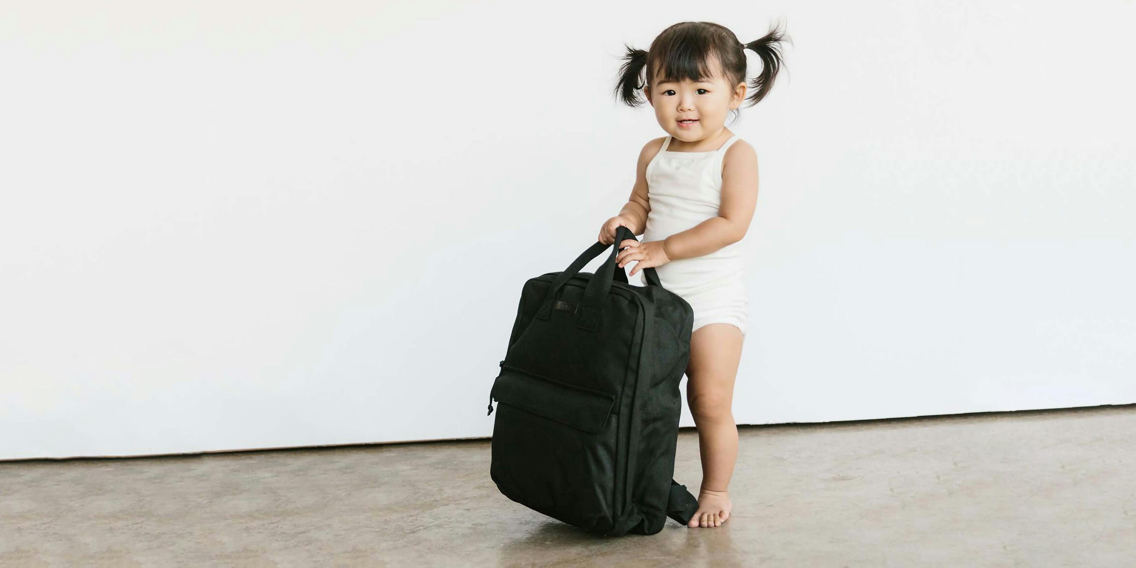 Photo of little girl carrying a Storq bag