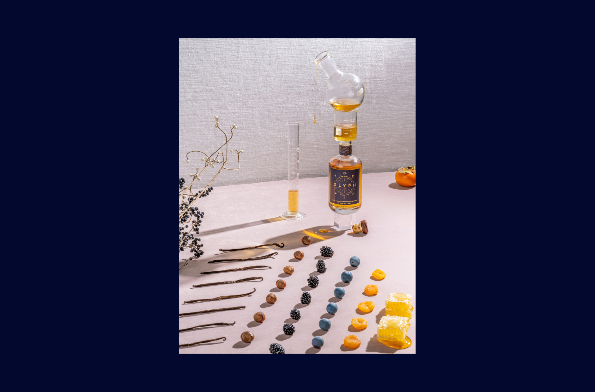 Still life photo of the Glyph bottle, fruits and test tubes